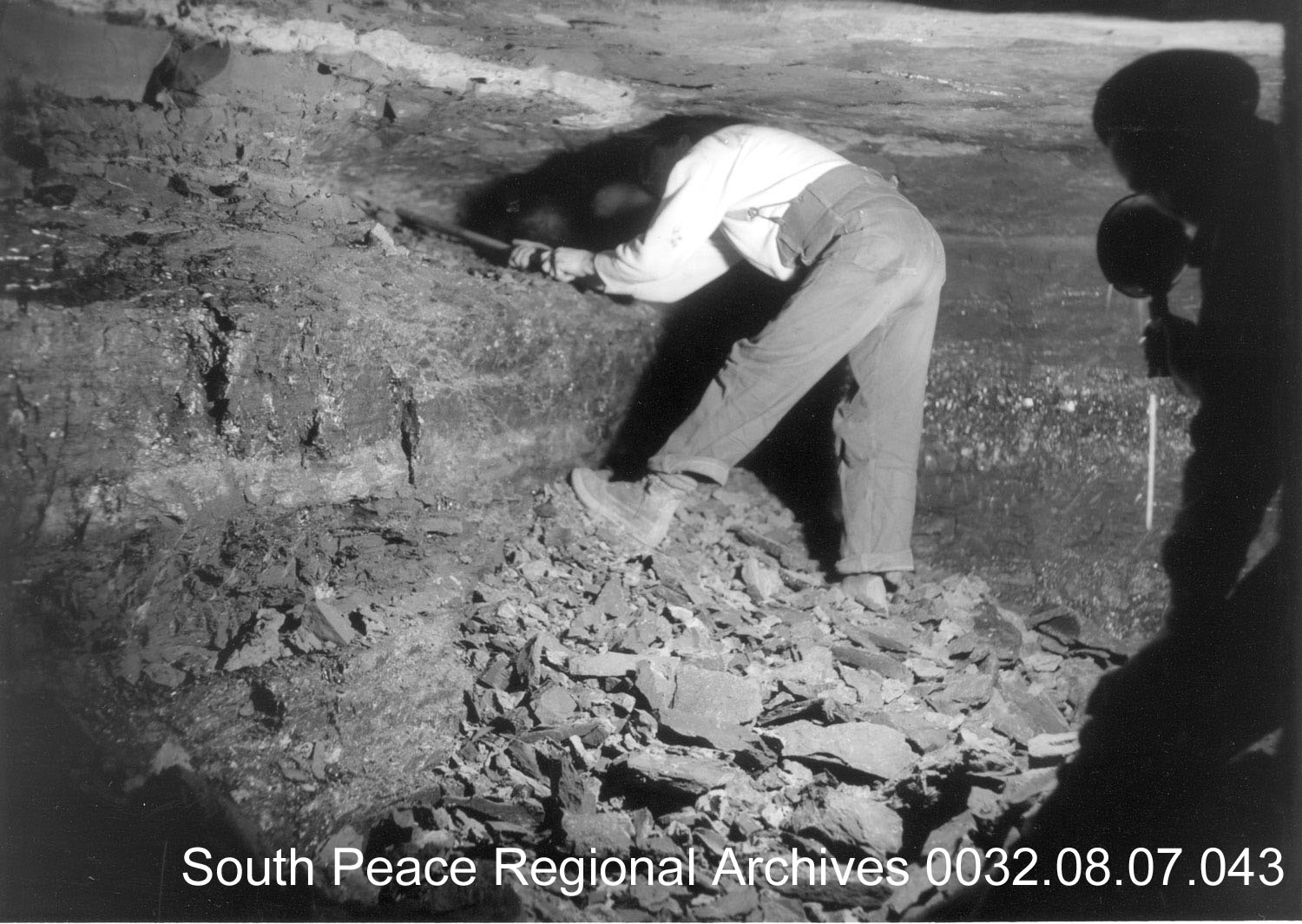 Miner working on a vein into a Wapiti Coal Mine c1936