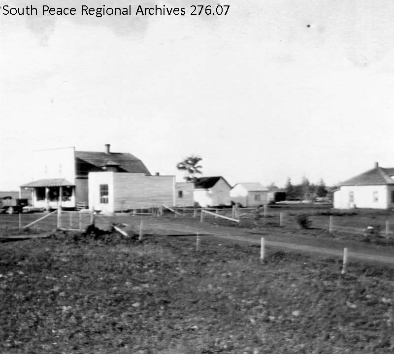 The Rio Grande Store and Post Office and its small cluster of buildings and houses made up the east half of the community of Rio Grande. Across the road was St. Patrick's Catholic Church and Rectory and the Rio Grande Hall, ca. 1930