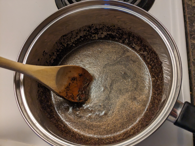 Image of a pot used in the Boiled Coffee recipe, with the coffee and egg slurry mixed inside.